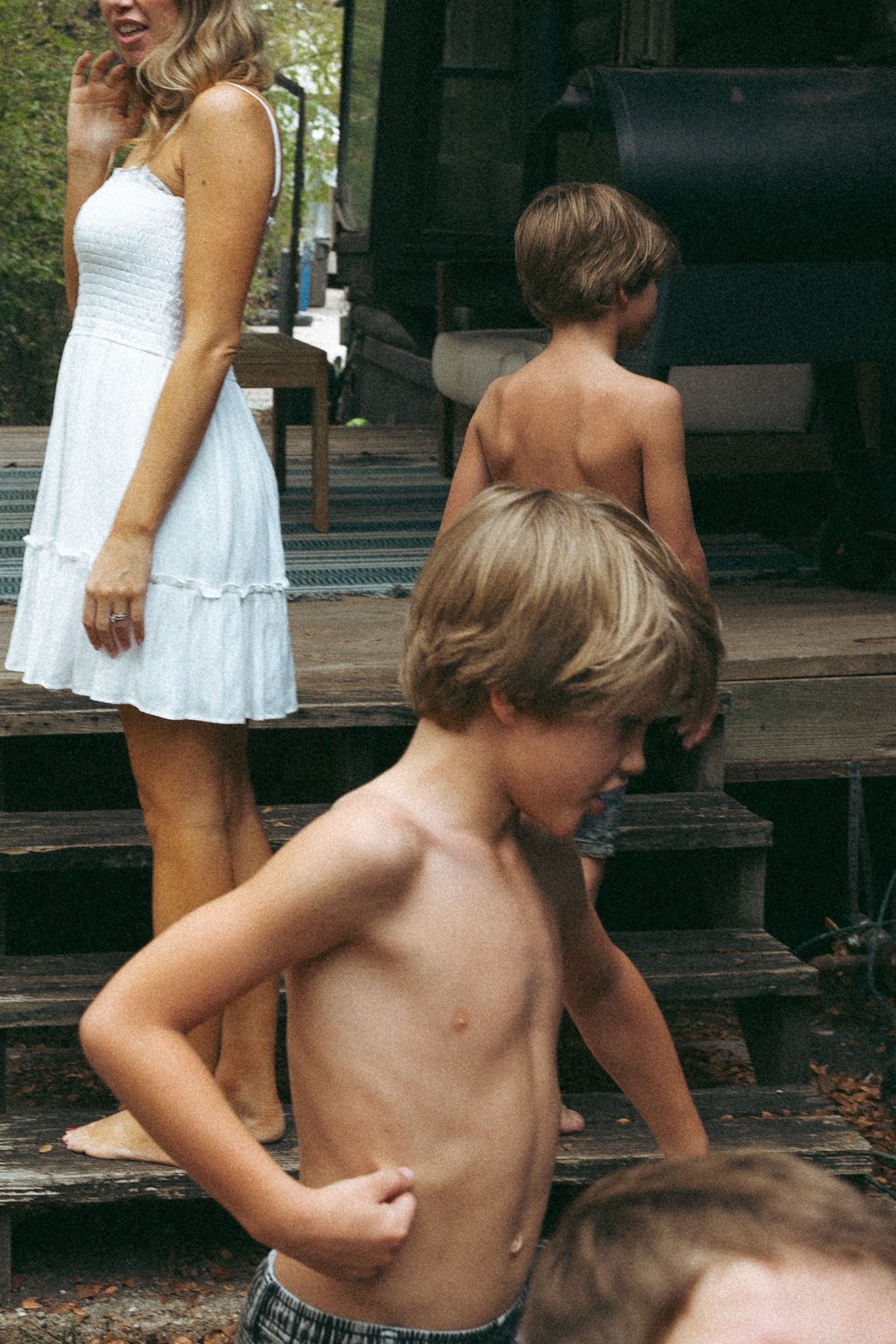  a mom with two of her sons during a family photography session 