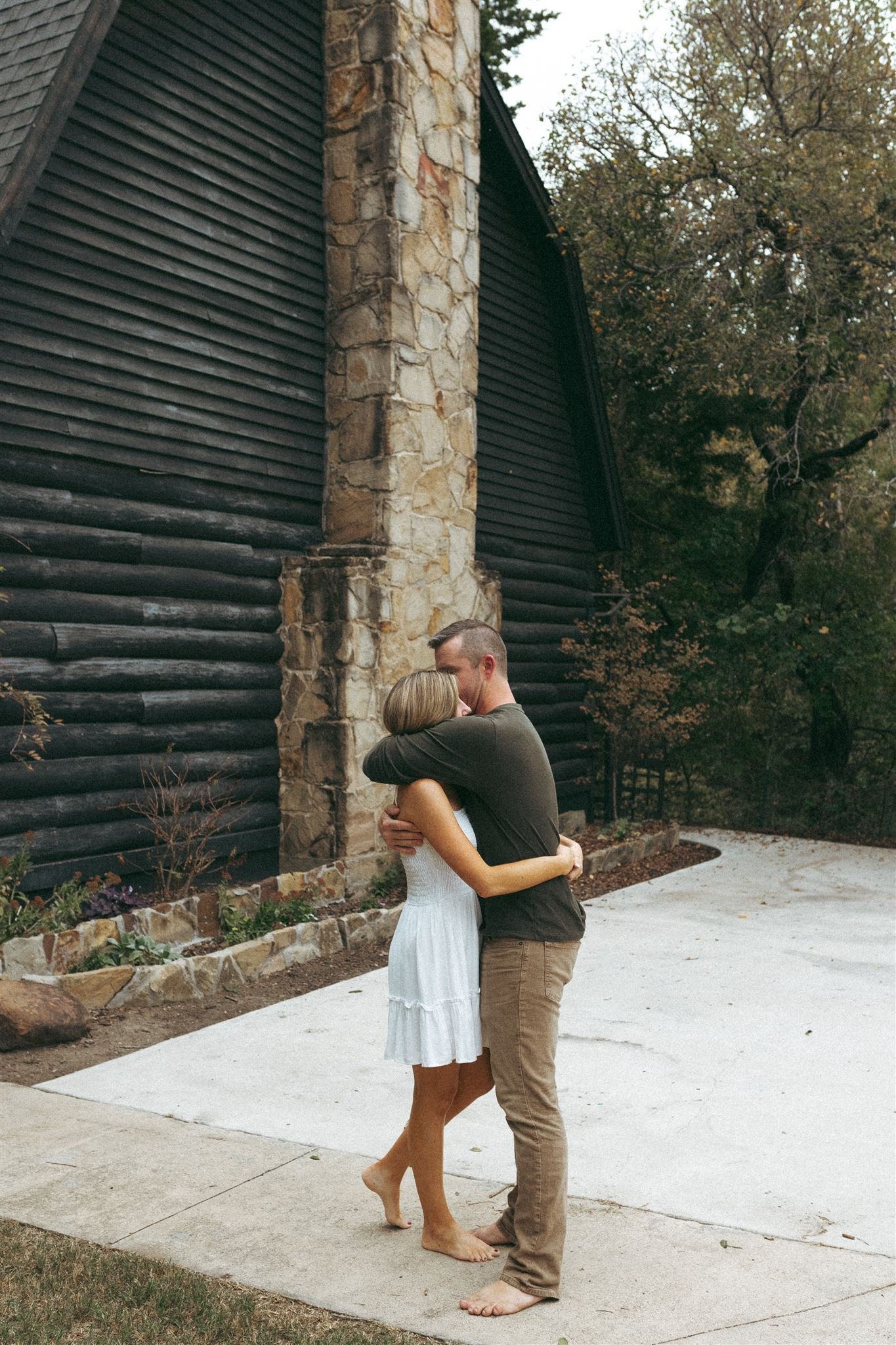  wife and husband embrace during a Dallas family photography session 