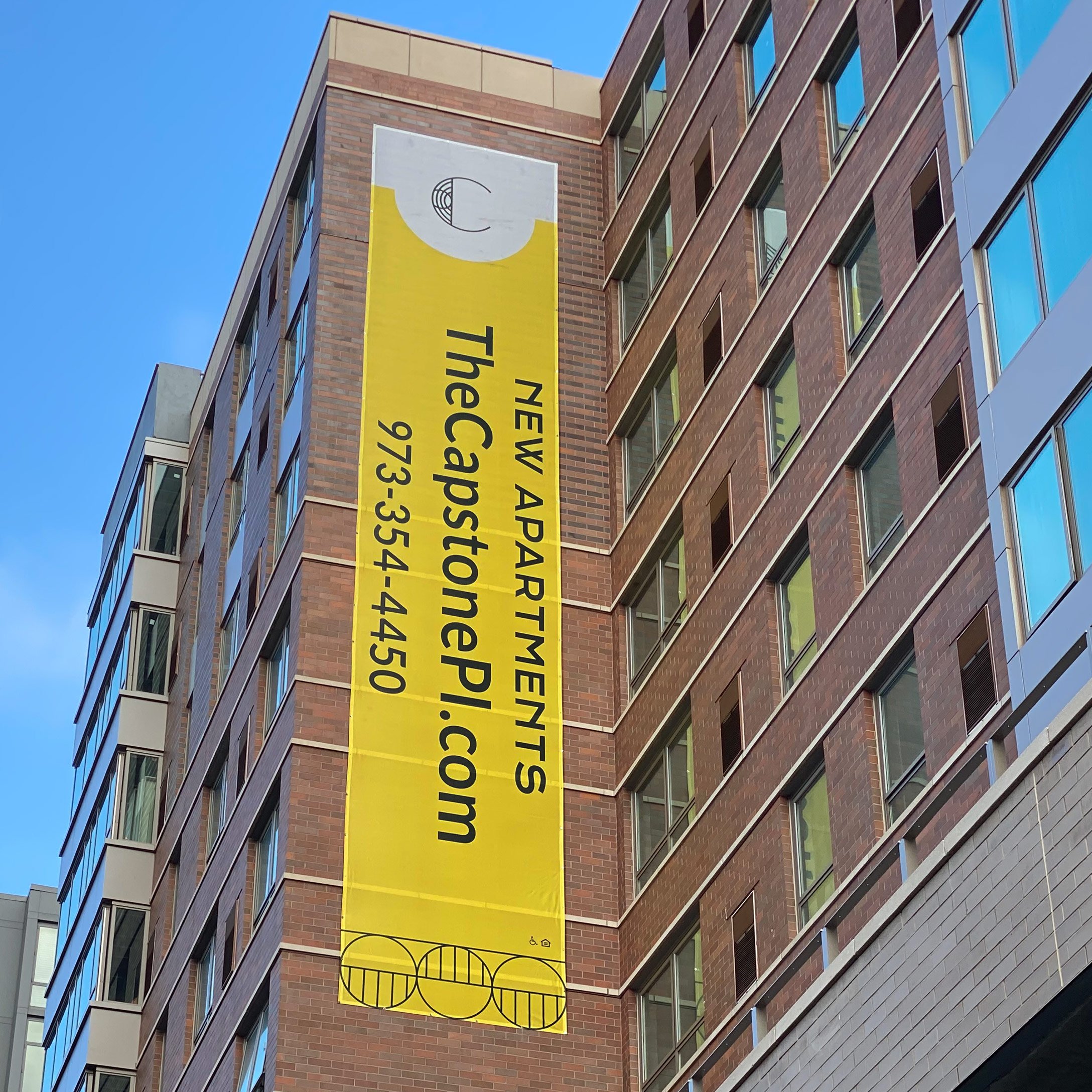The Capstone Apartments building banners