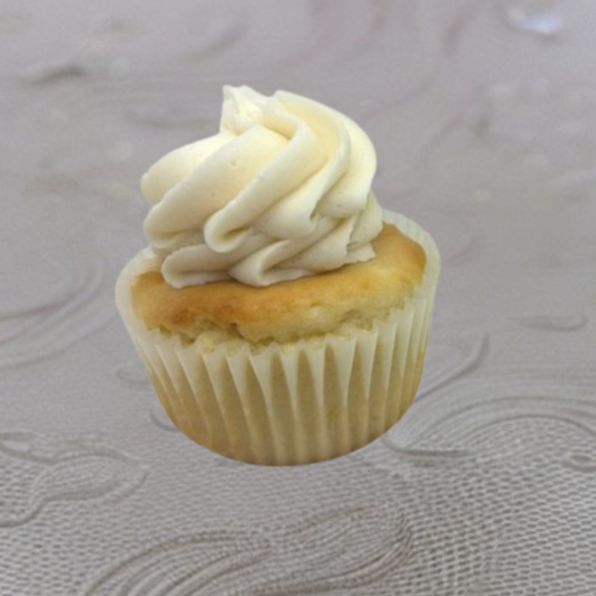 Vanilla cupcake with swirled white frosting on top.