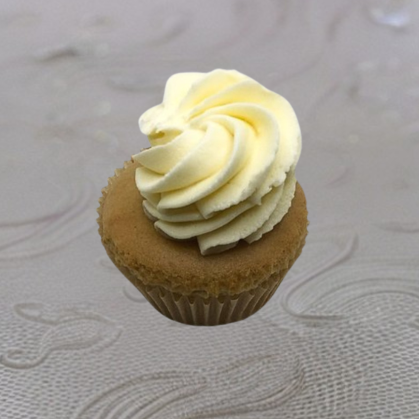 Chocolate cupcake with white frosting swirl on top, in a ridged paper liner.