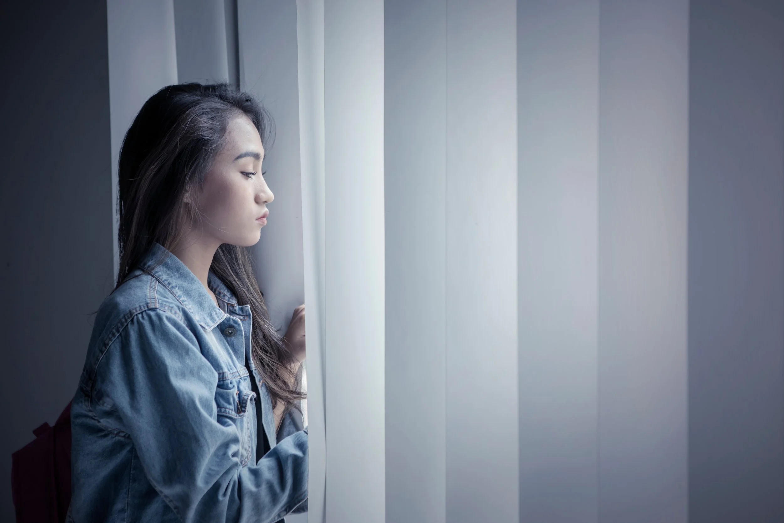 Asian teen or young adult seeking brainspotting, EMDR, family, or acceptance and commitment therapy for substance use and trauma.