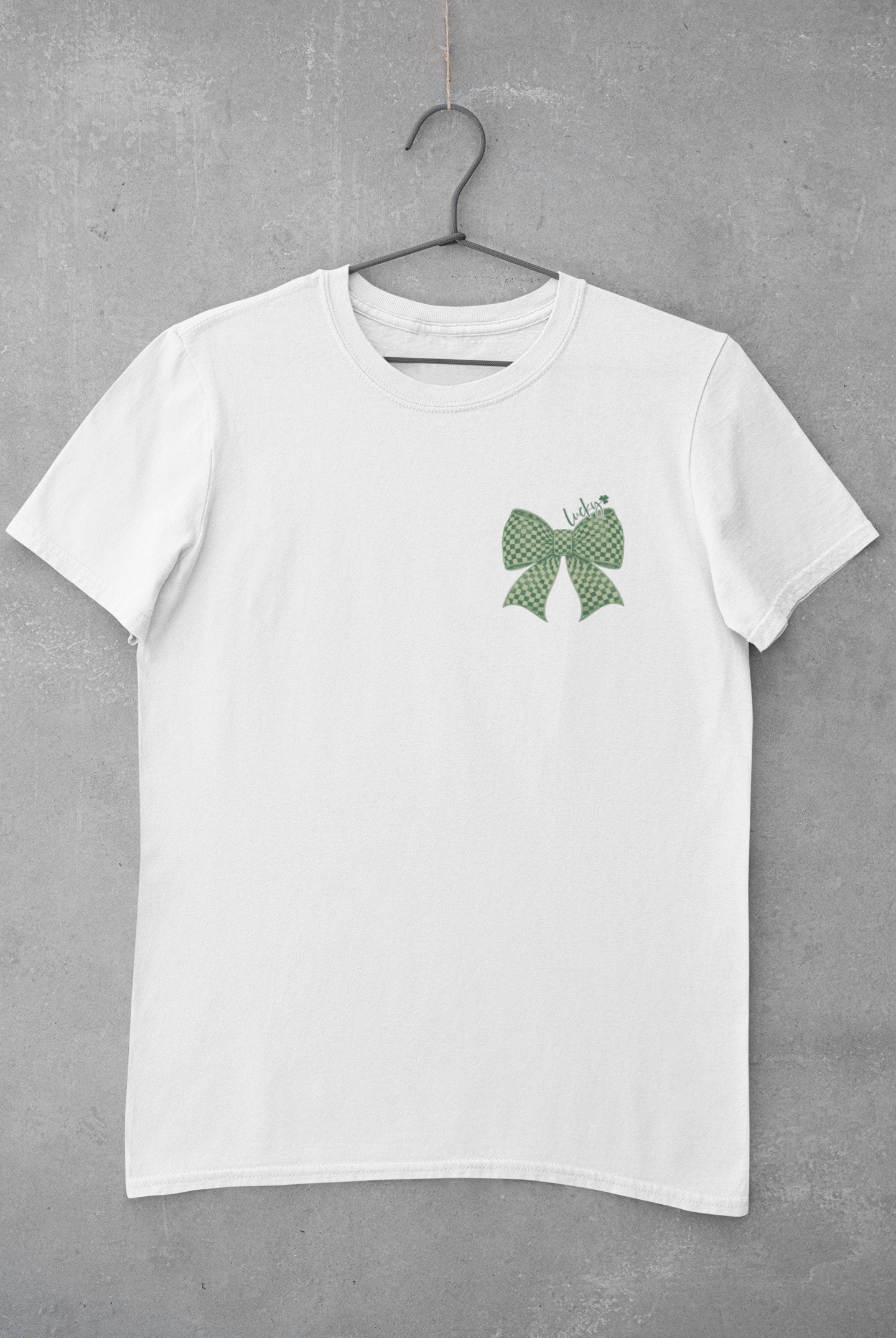 mockup-of-a-basic-tee-hanging-on-a-concrete-wall-33689.png