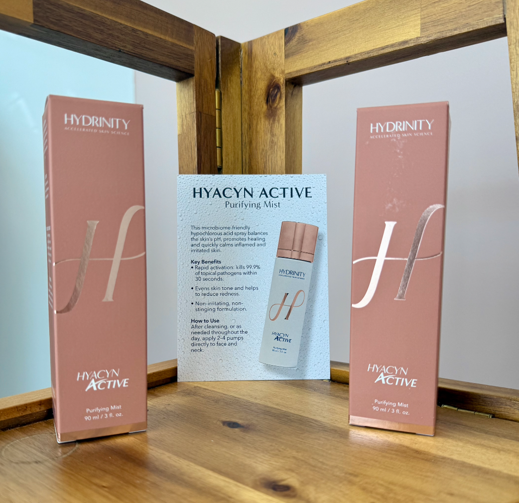 HYACYN ACTIVE Purifying Mist product package and promotional card on shelf. Revival Aesthetics Westford MA carries Hydrinity Line of skincare products