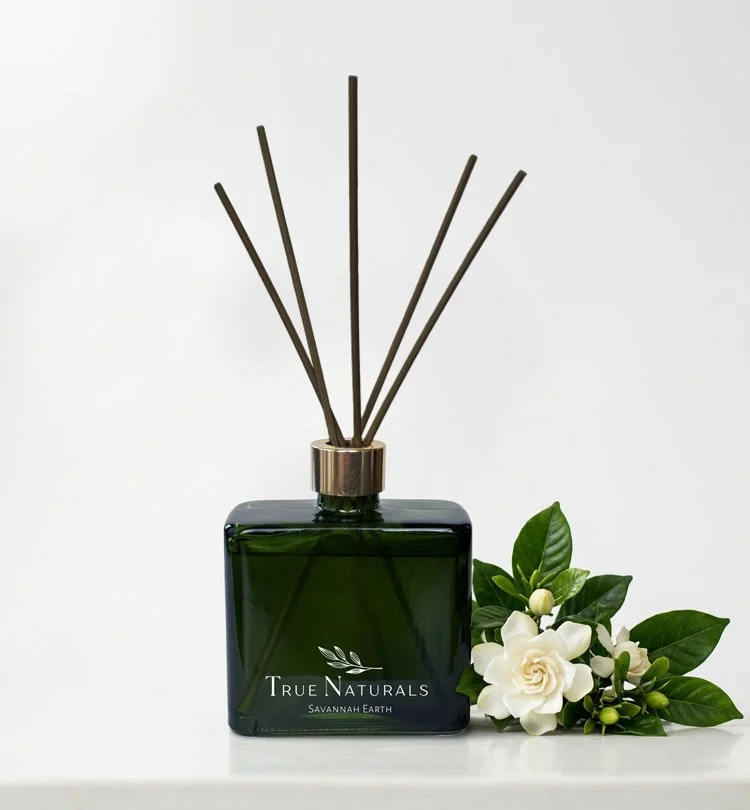 True Naturals Savannah Earth Reed Diffuser with gardenia flowers. All natural home products with the power of pure essential oils.