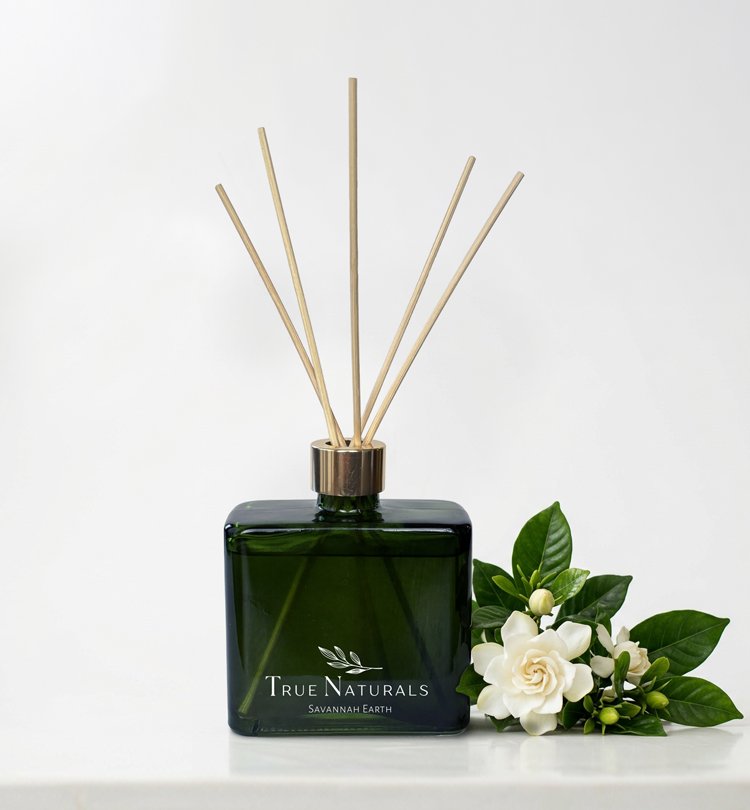 True Naturals Savannah Earth Reed Diffuser with gardenia flowers. All natural home products with the power of pure essential oils.