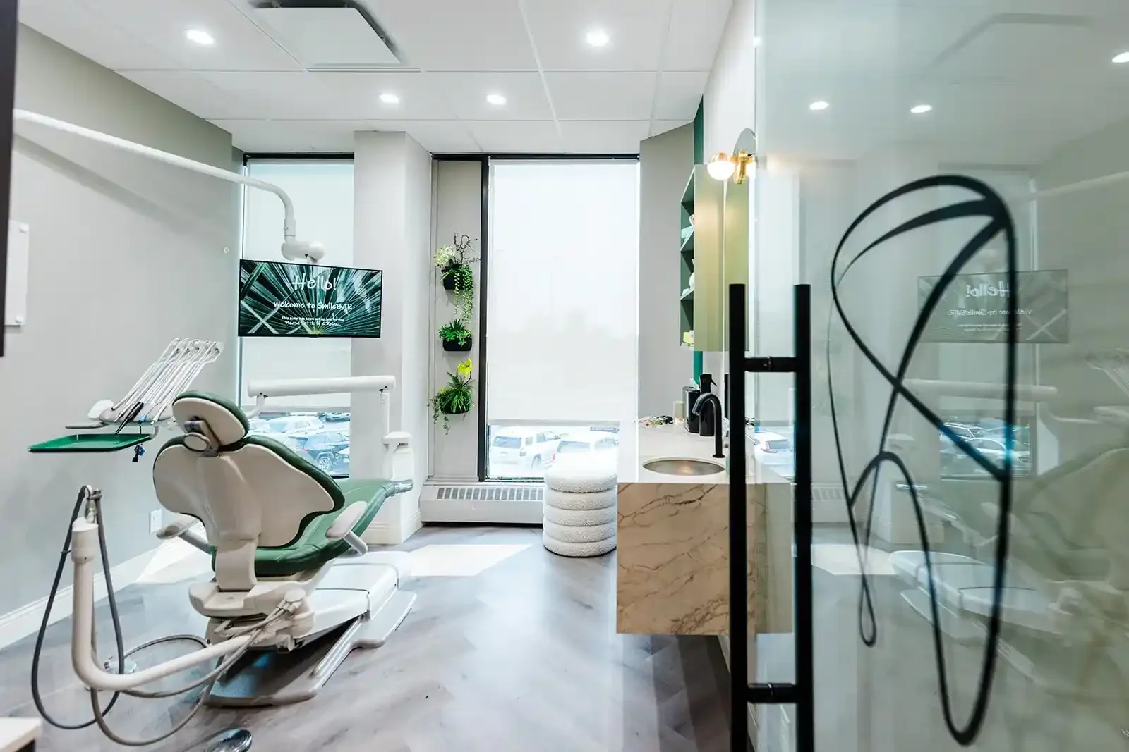 Modern treatment room and patient chair at Smile Bar dental clinic in Calgary.