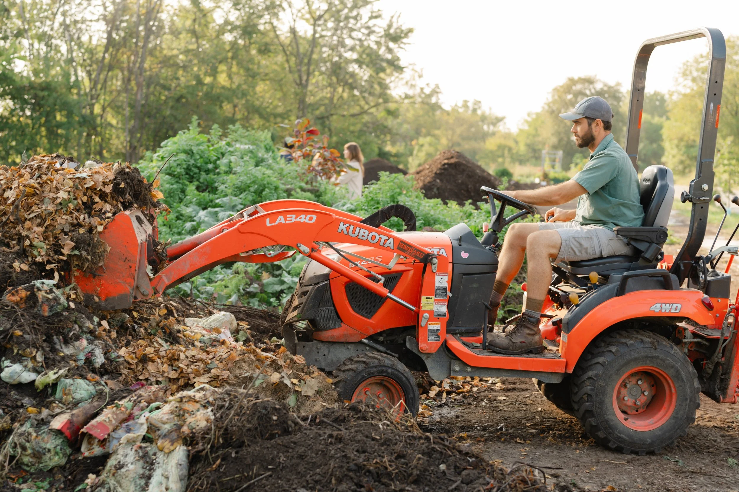 Parker Jean on a tractor at Sanctuary Farms