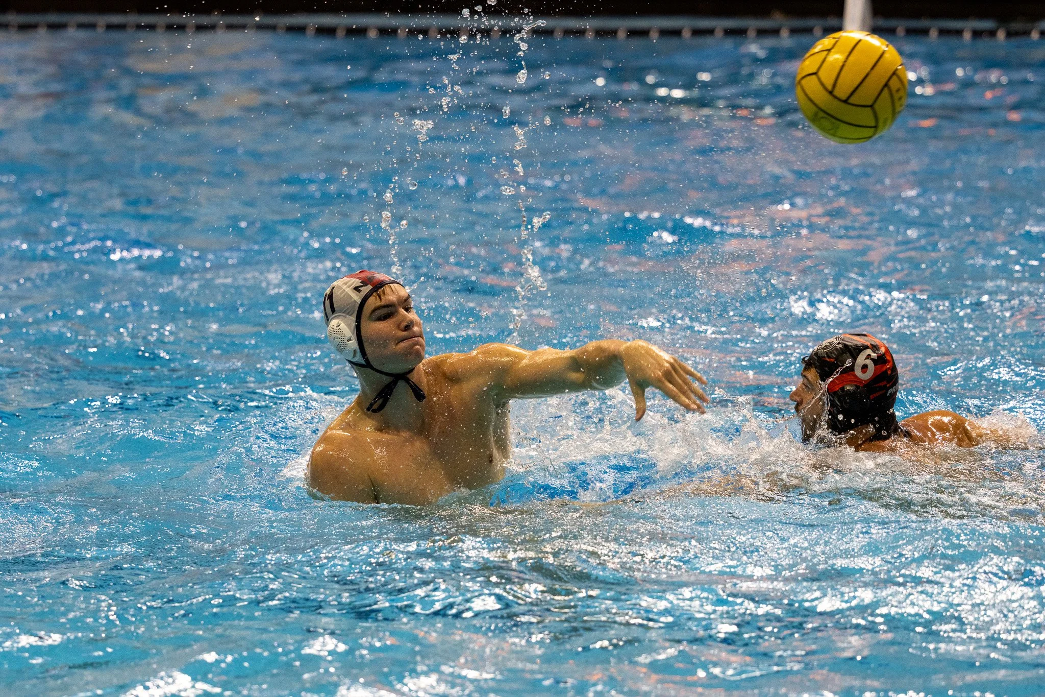 Water polo player passing the ball Princeton University