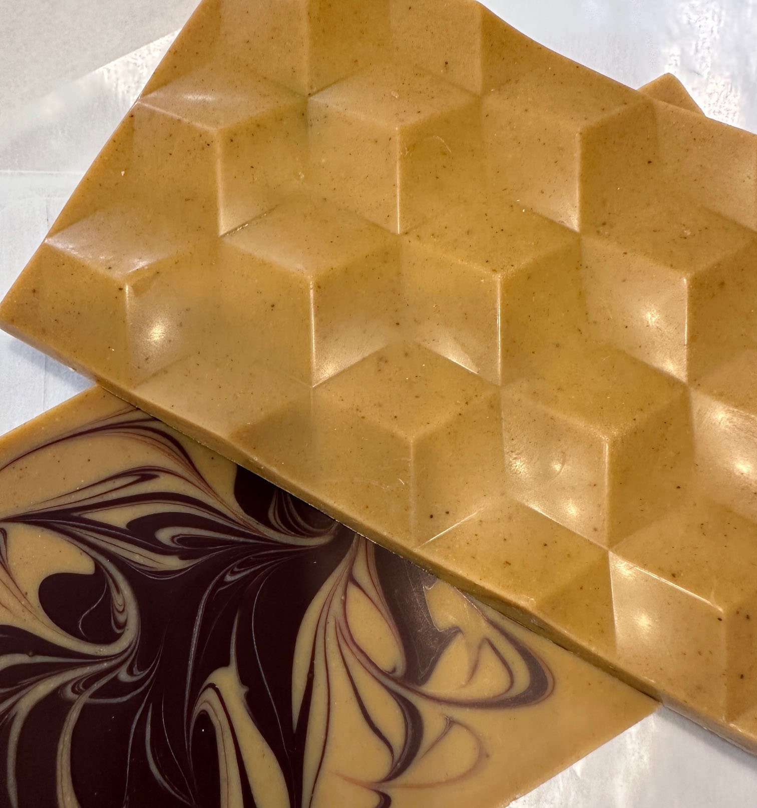 Image of chocolate bar that is made with natural pumpkin and a swirl of dark chocolate.