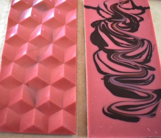 Image of chocolate bar that is made with natural strawberry flavors and a swirl of dark chocolate.