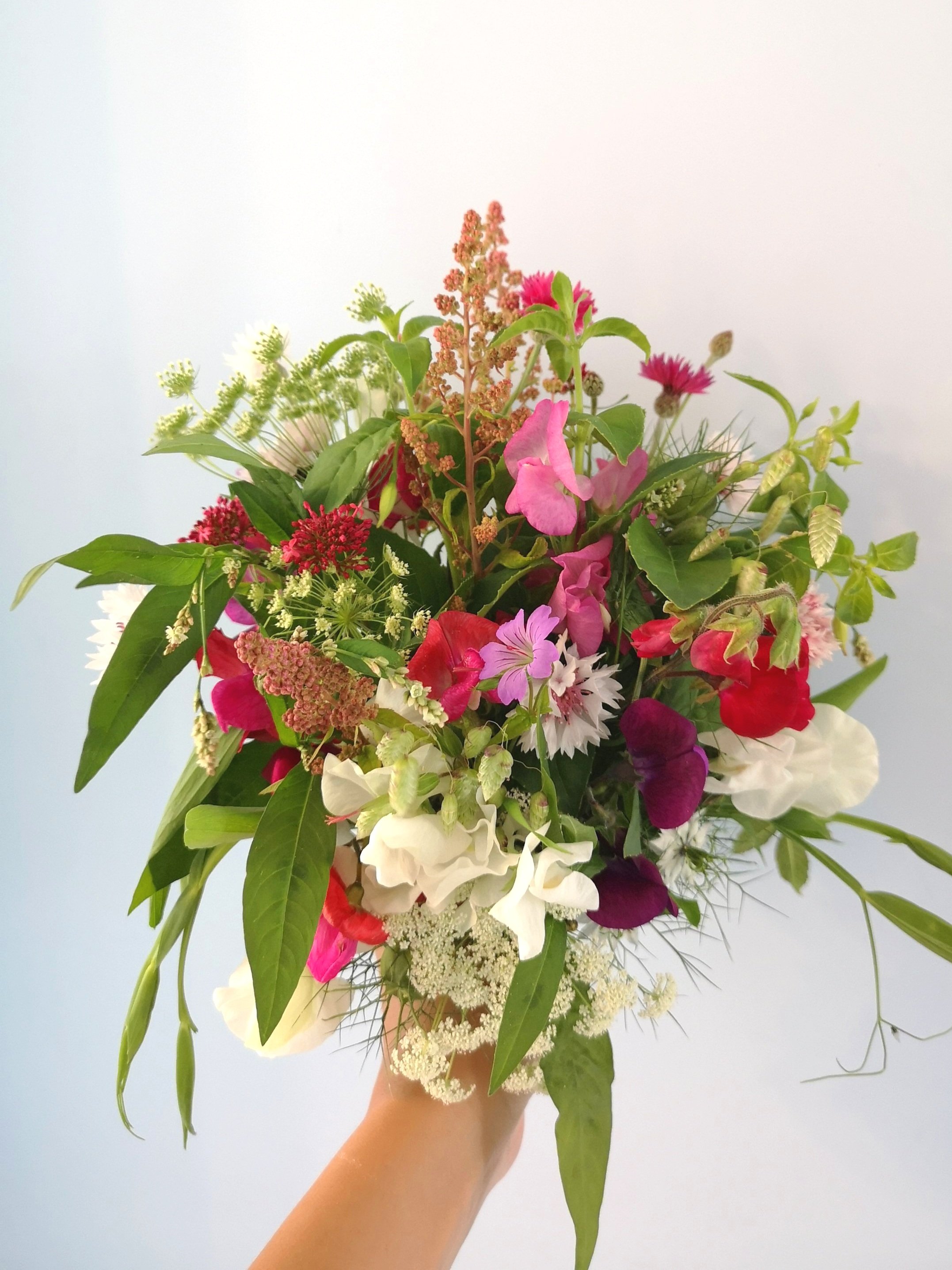 A loose, whimsical hand-tied bouquet for an LGBTQ wedding in Liverpool. This pink and white bridal bouquet is perfect for a same sex elopement