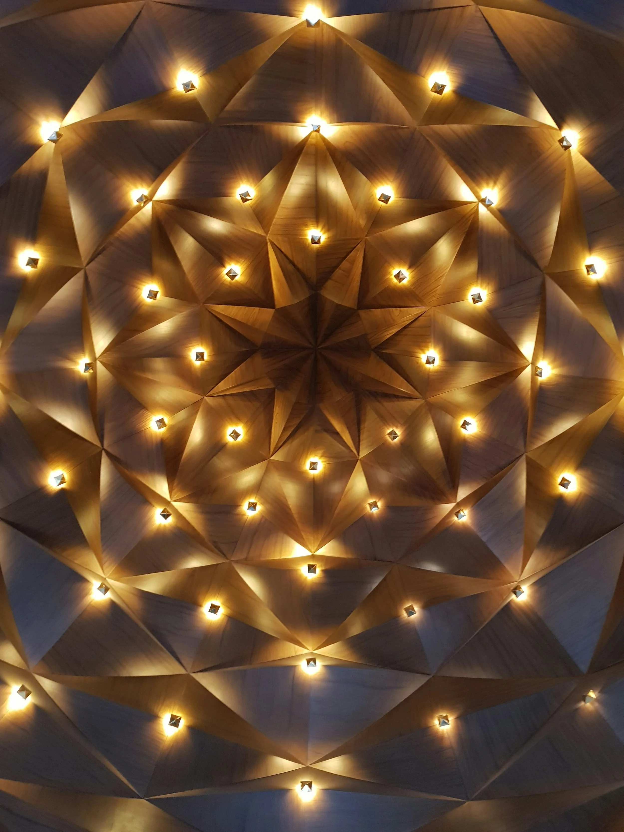 Geometric ceiling design with embedded lights