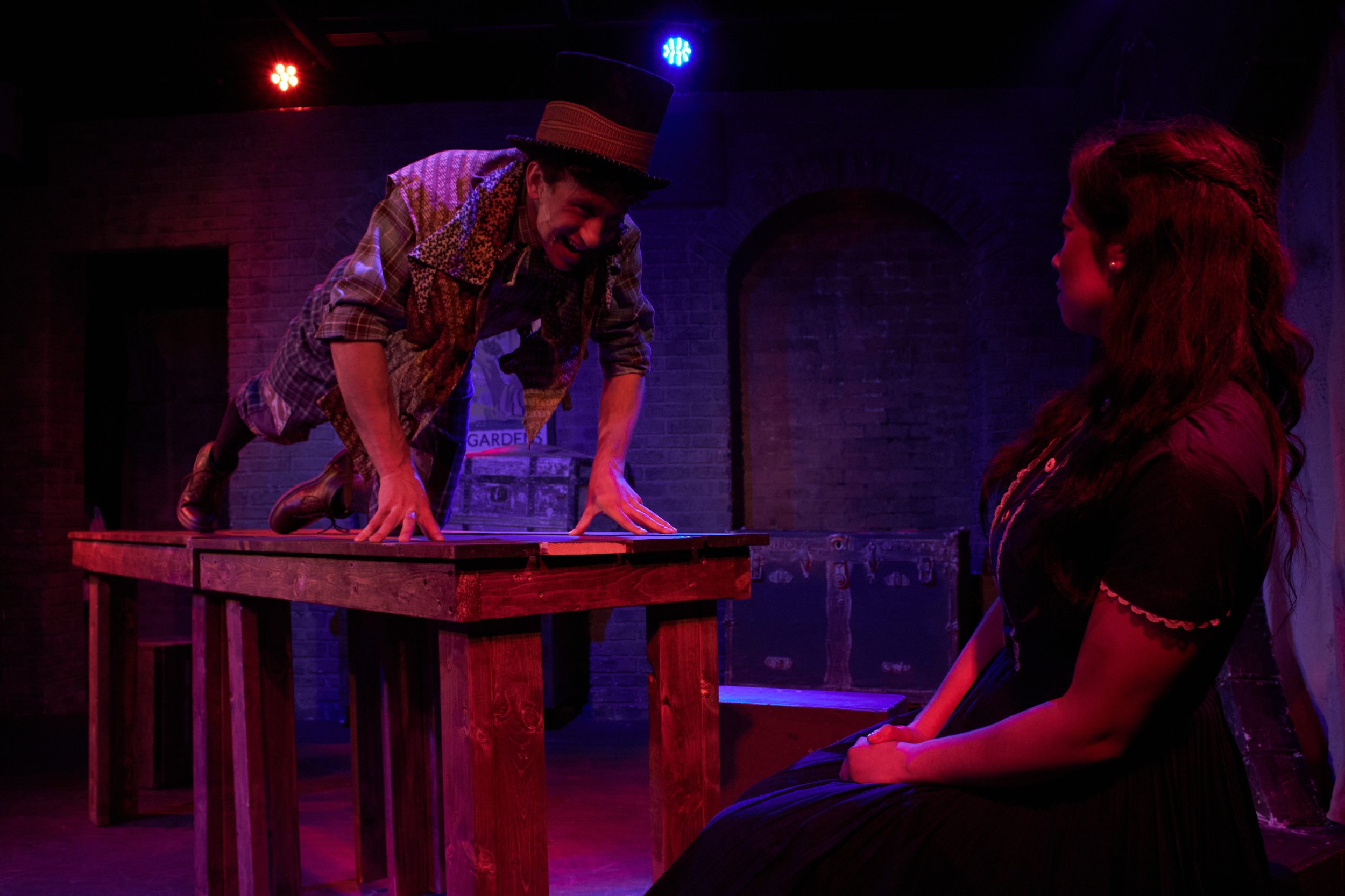 Ben Friesen's 'Mad Hatter' aggressively informs Sachiko Nicholson's 'Alice' that he is "Sick to Death of Alice-ness".