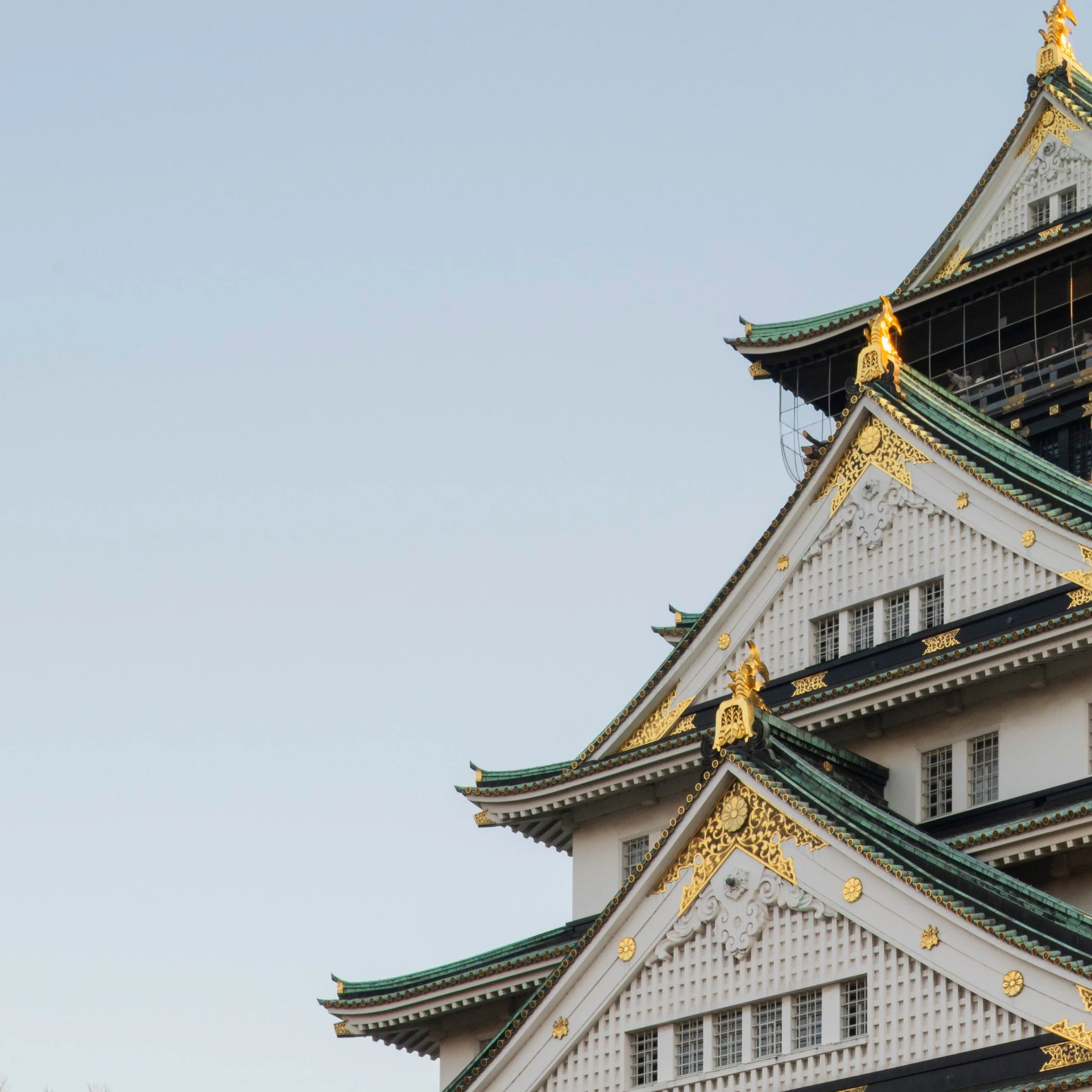 Osaka Castle's tiered roofline against the evening sky, Osaka, Japan