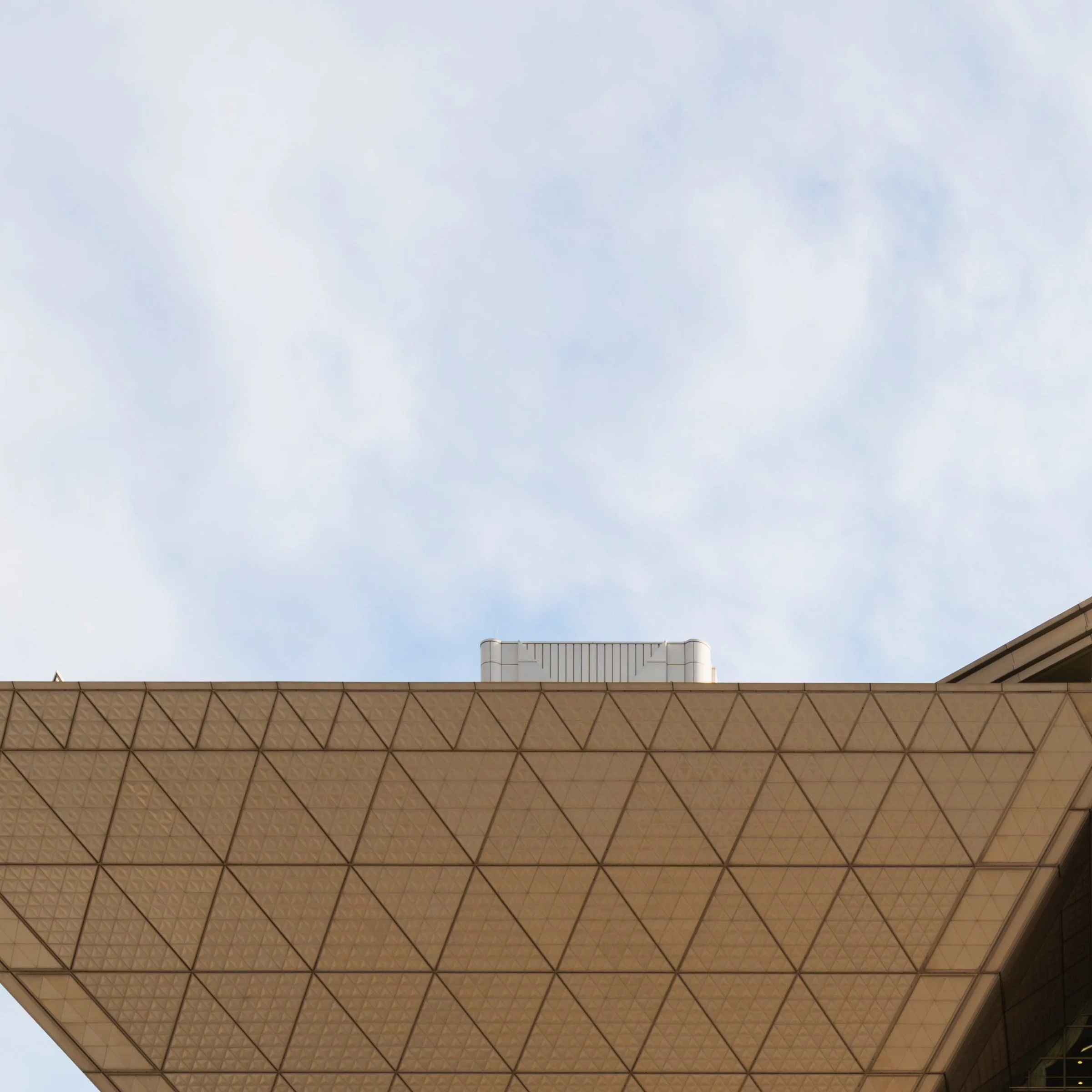 Inverted pyramid underside against blue sky, Tokyo Big Sight, Japan