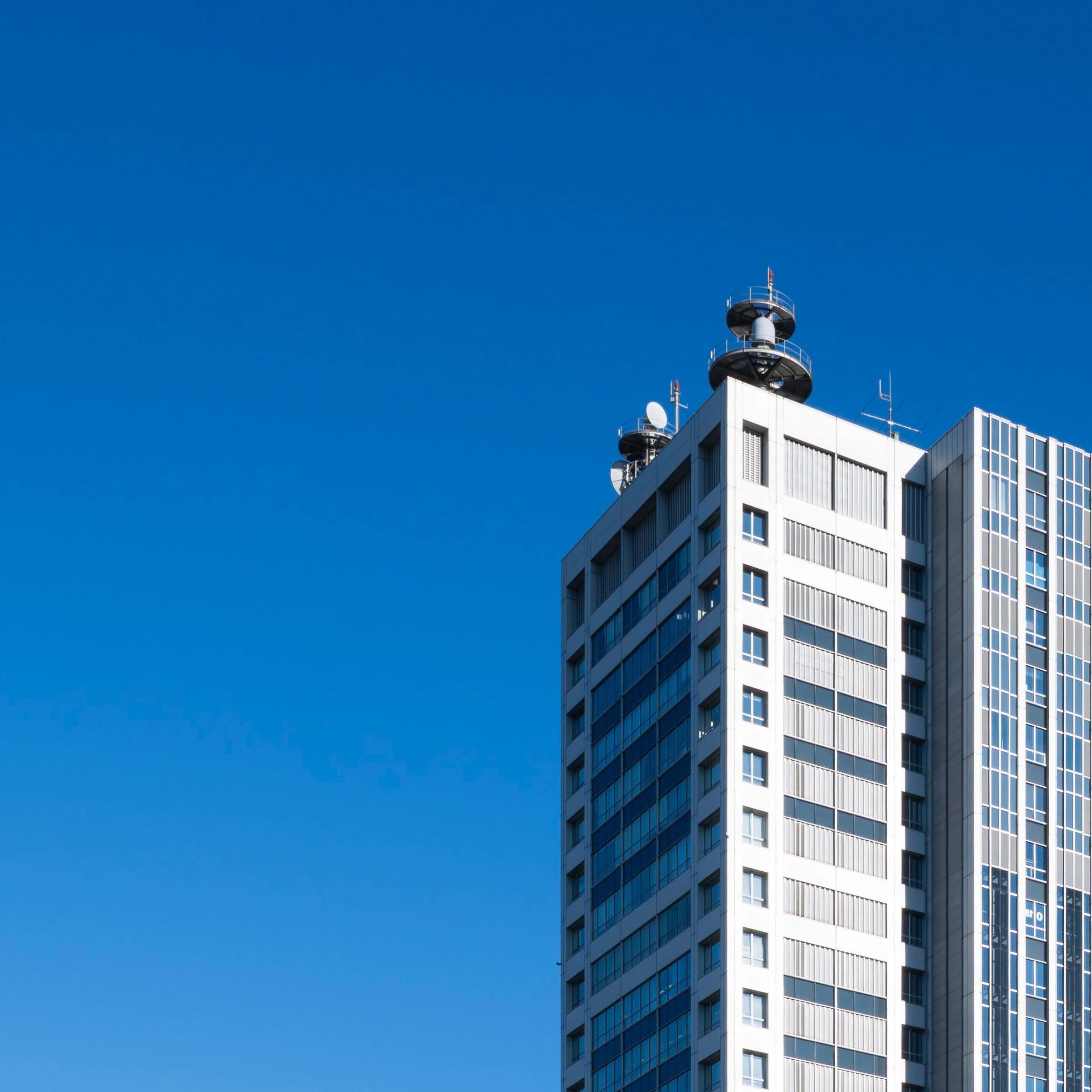 White tower facade against clear sky, Odaiba, Tokyo, Japan