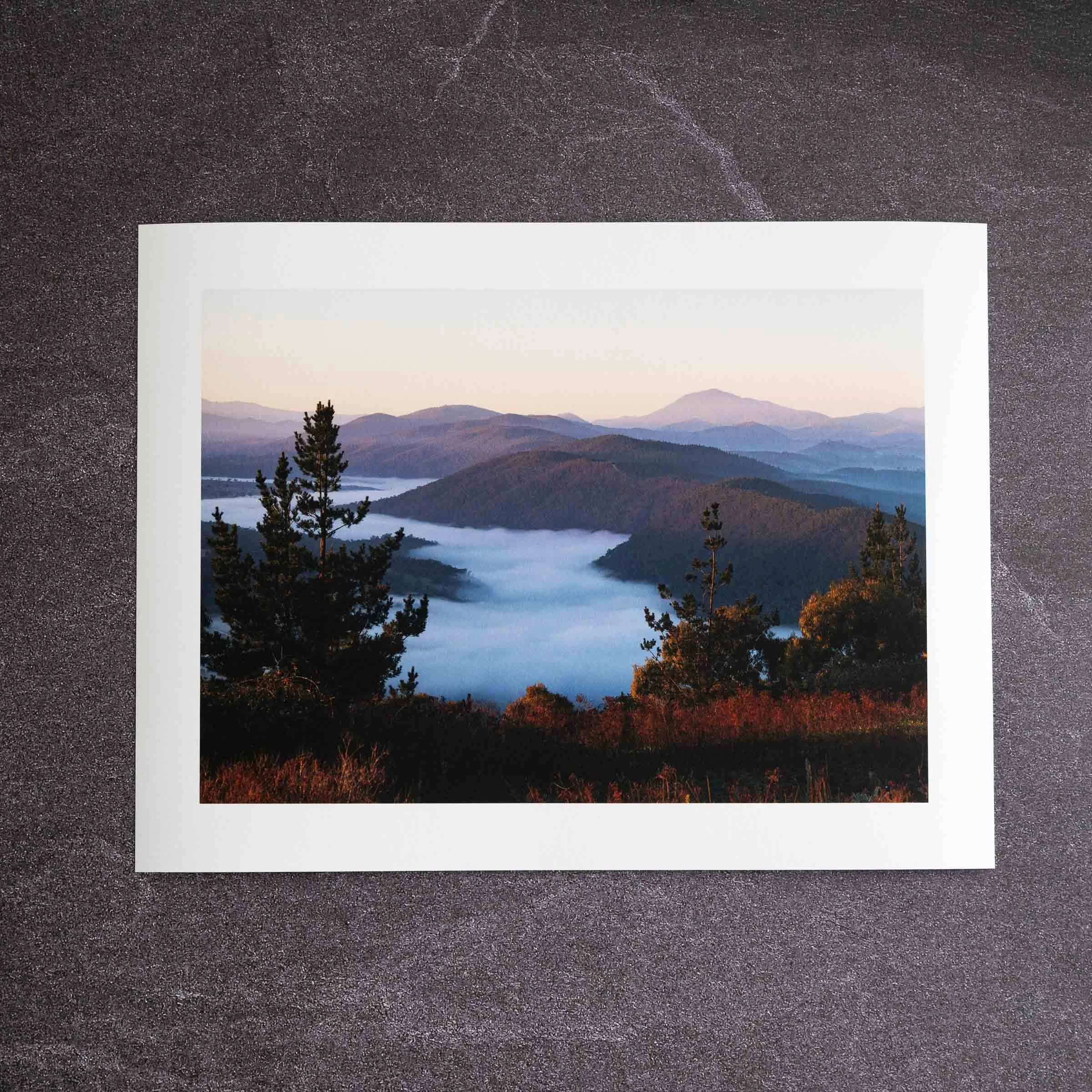 Fine art photography print with a 25mm white border on dark stone background