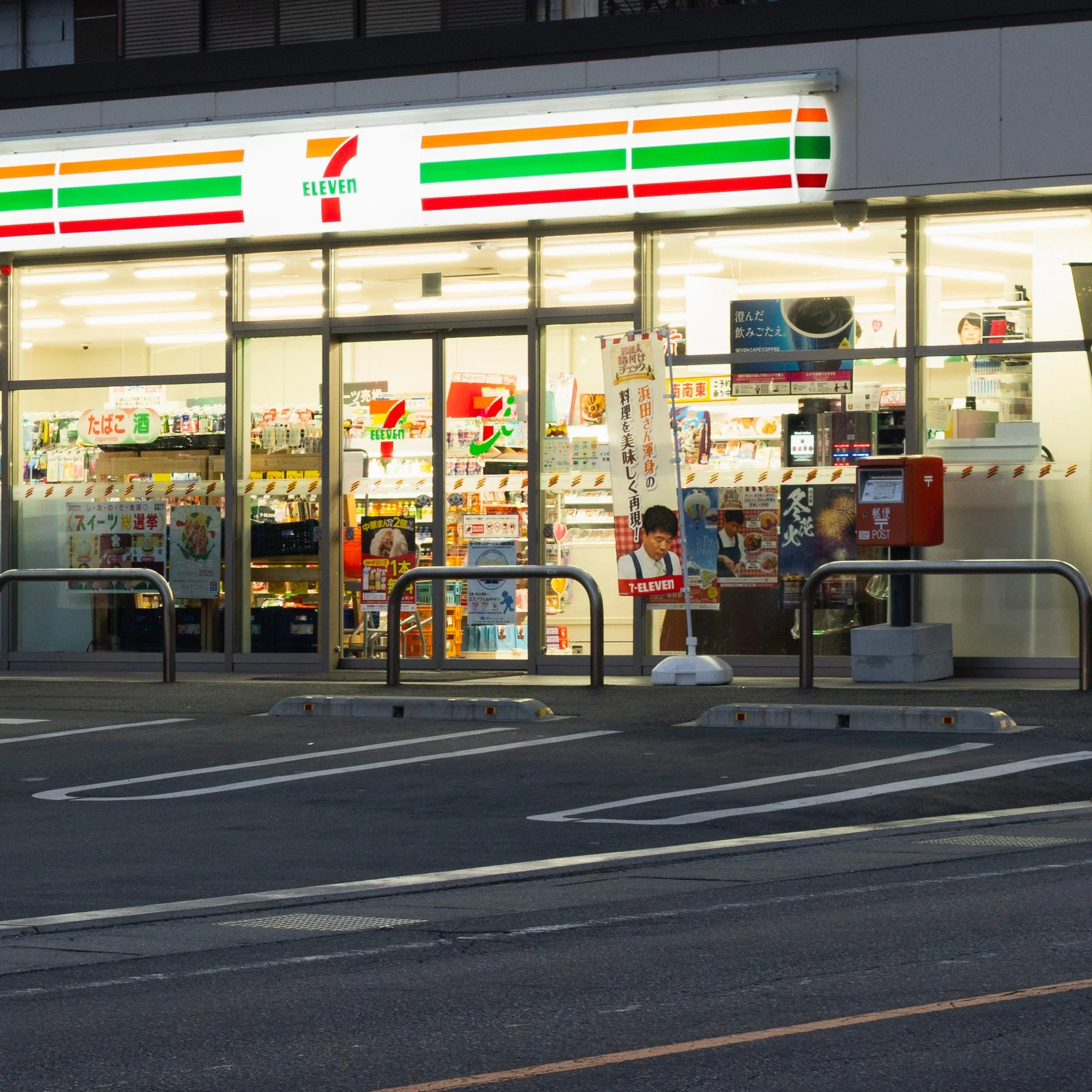 Lit convenience store front below Mount Fuji, Fujiyoshida, Japan