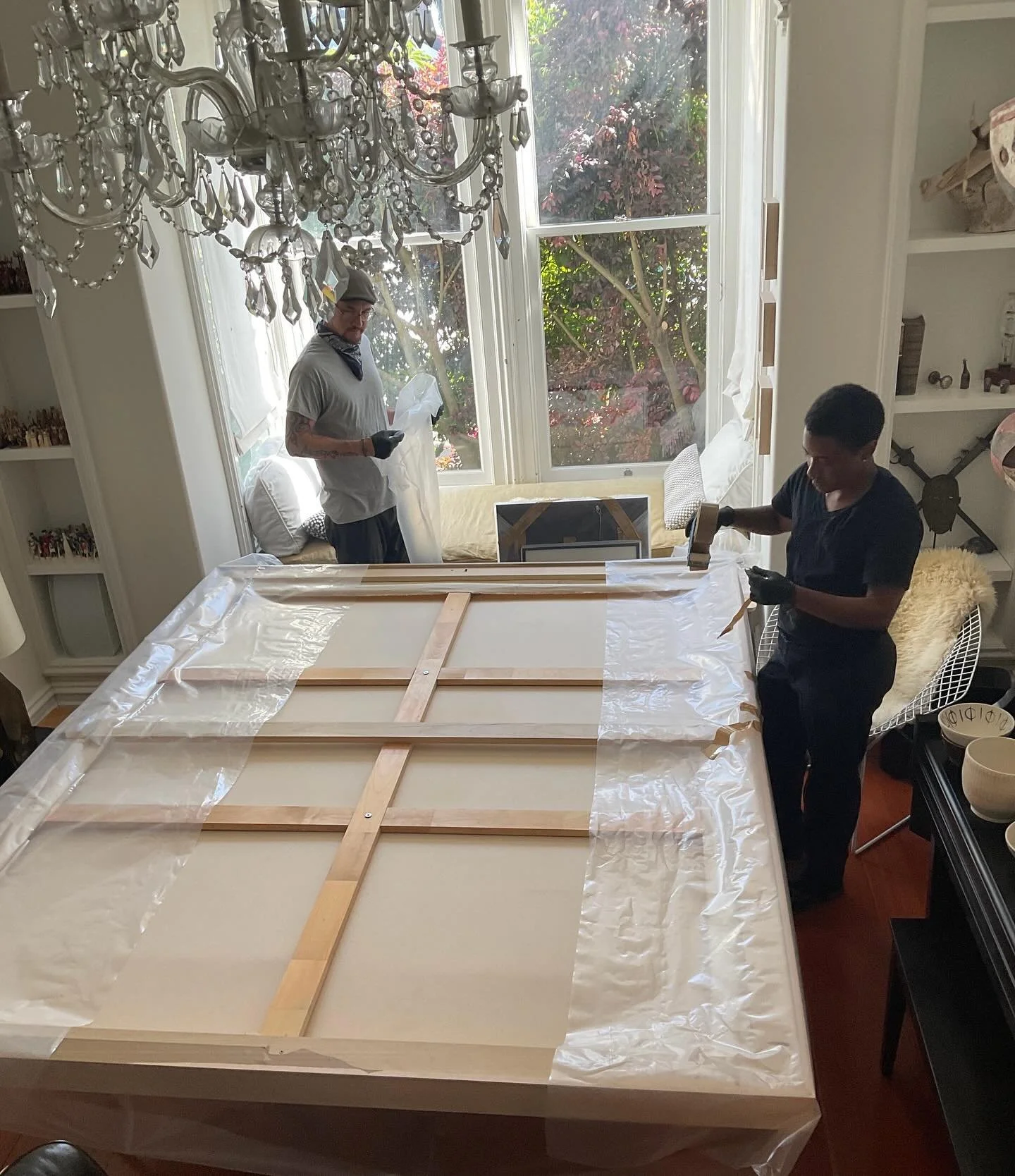 Proper protection is crucial for keeping your flat artworks in pristine condition! We offer wrapping services both onsite and at our studio. Soft packing with poly sheeting and cardboard corners will ensure your art is well protected while being stor