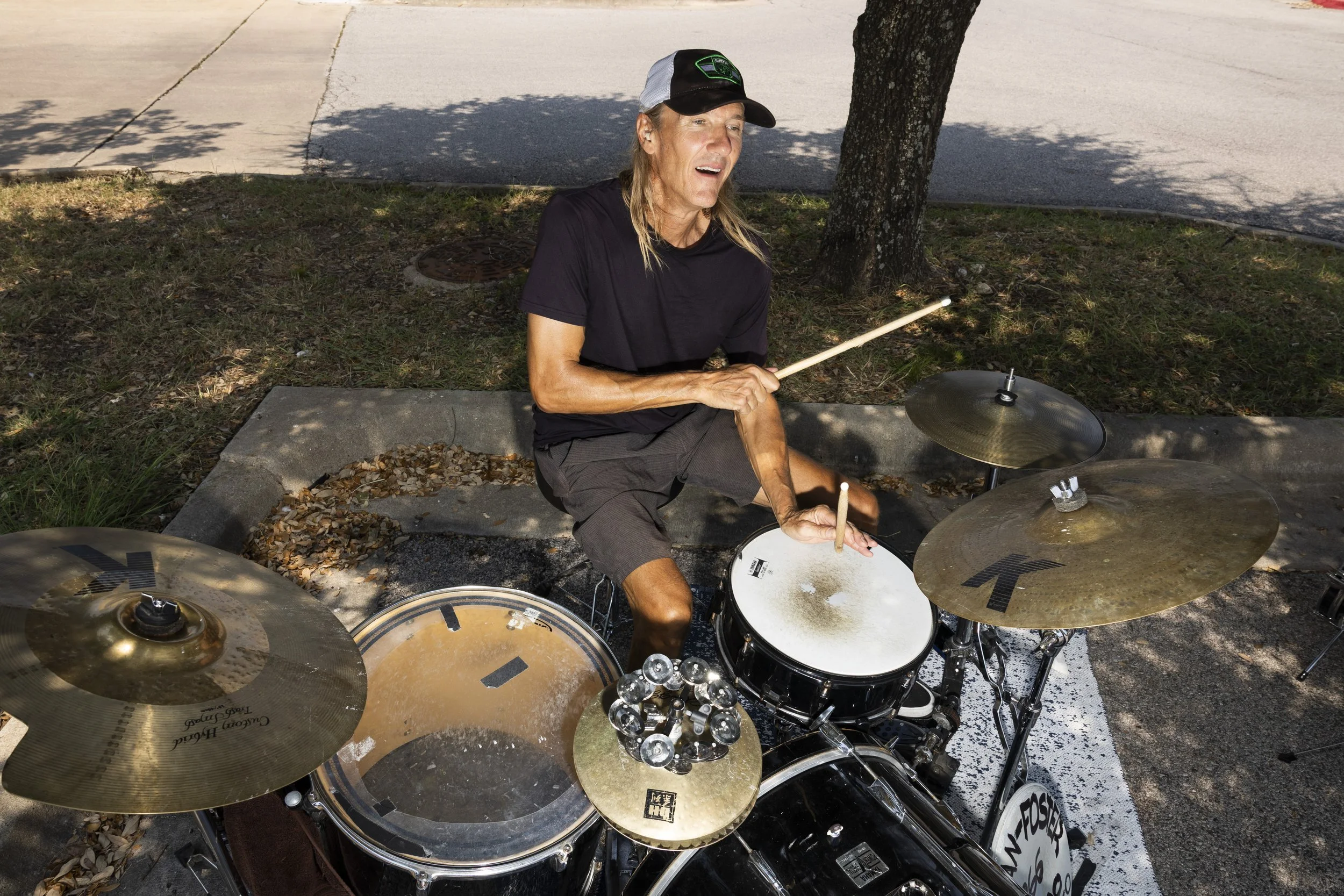 Brian Foster busks outside of Sam's Club in North Austin on Aug. 7, 2025.