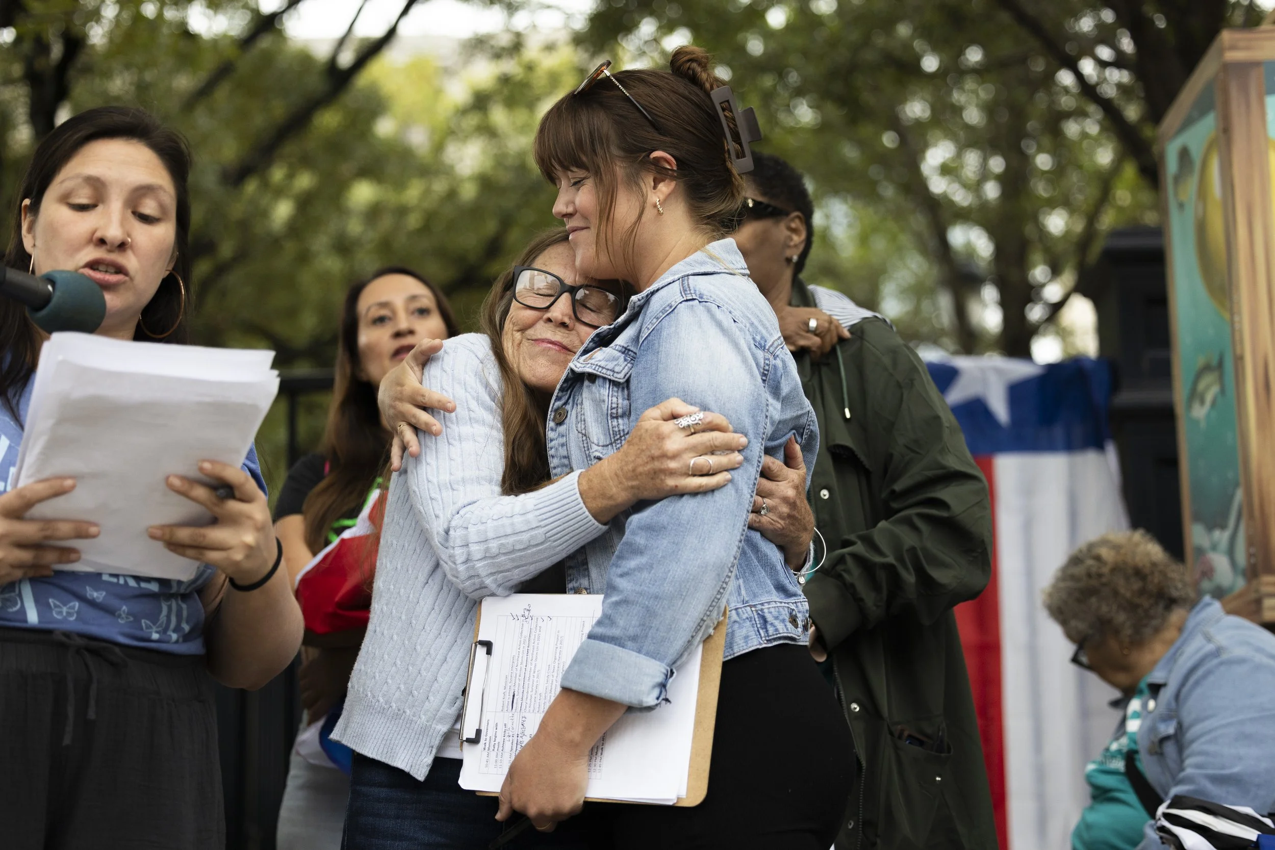 Sandy Creek flood survivor Brandy Gertsner embraces her daughter Ashlee Willis outside the Governor’s mansion during a rally in downtown Austin, TX, on November 21, 2025.