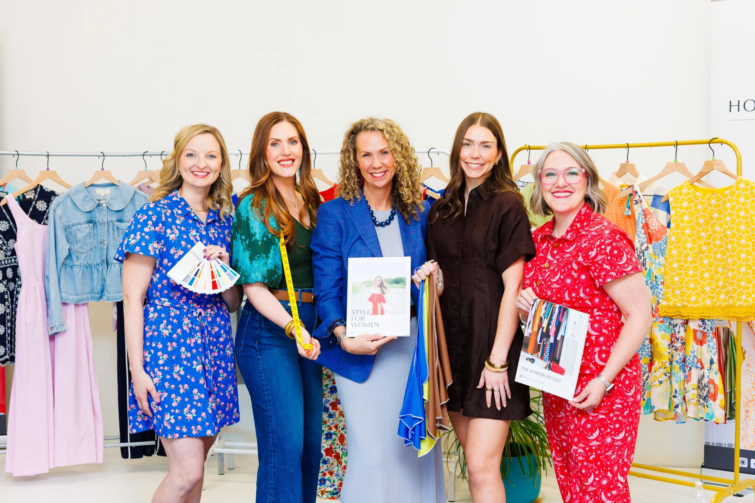 branding photo of House of Colour team with style books and color swatches.