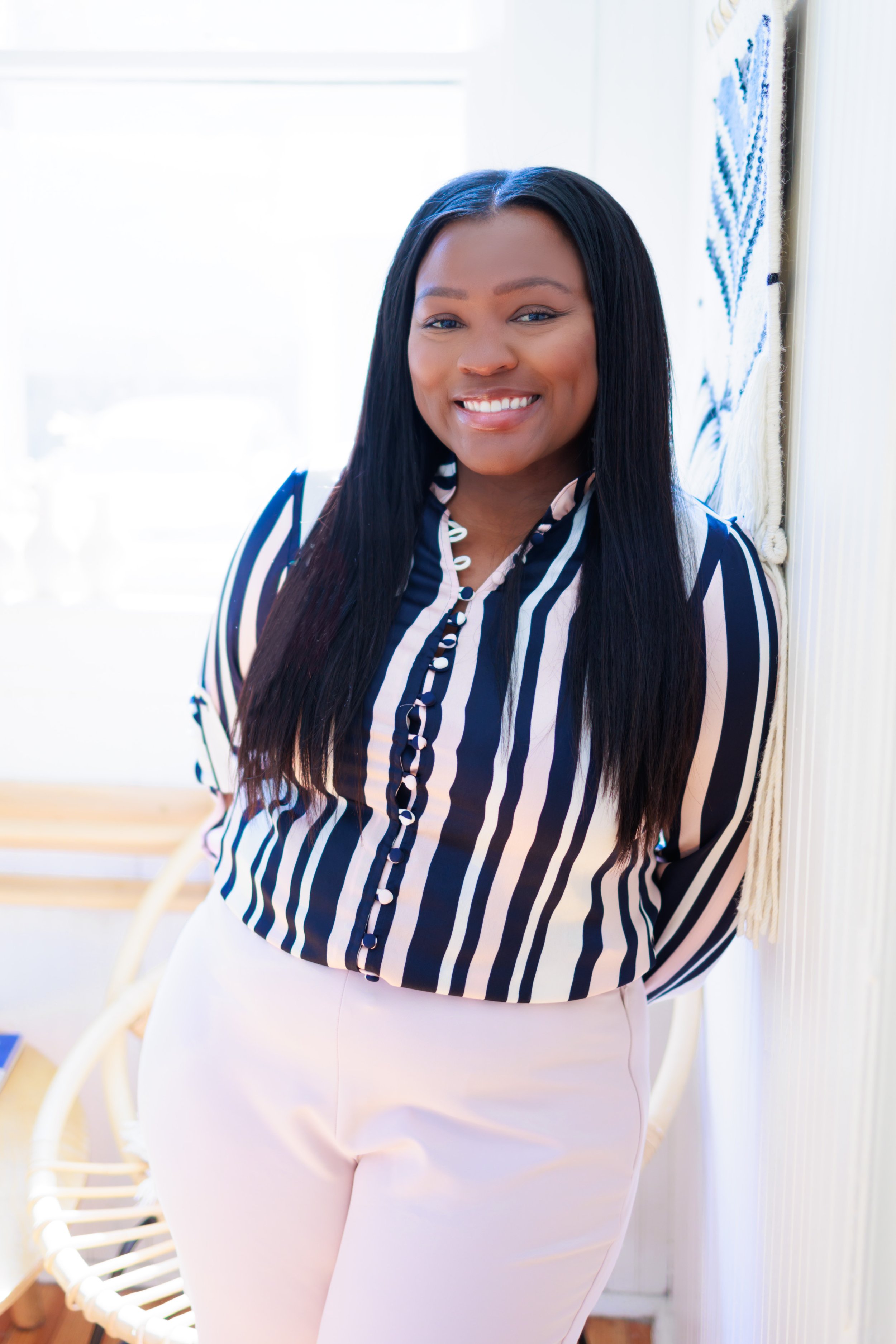 Professional Headshot of woman in striped shirt