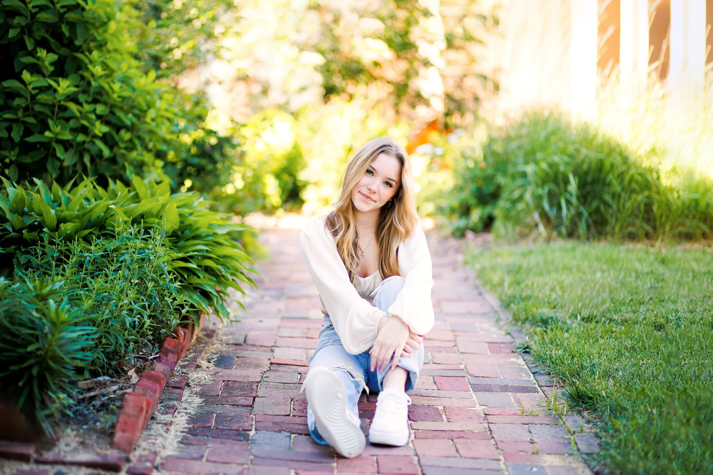 senior picture of a girl on a brick path in Papillion, NE