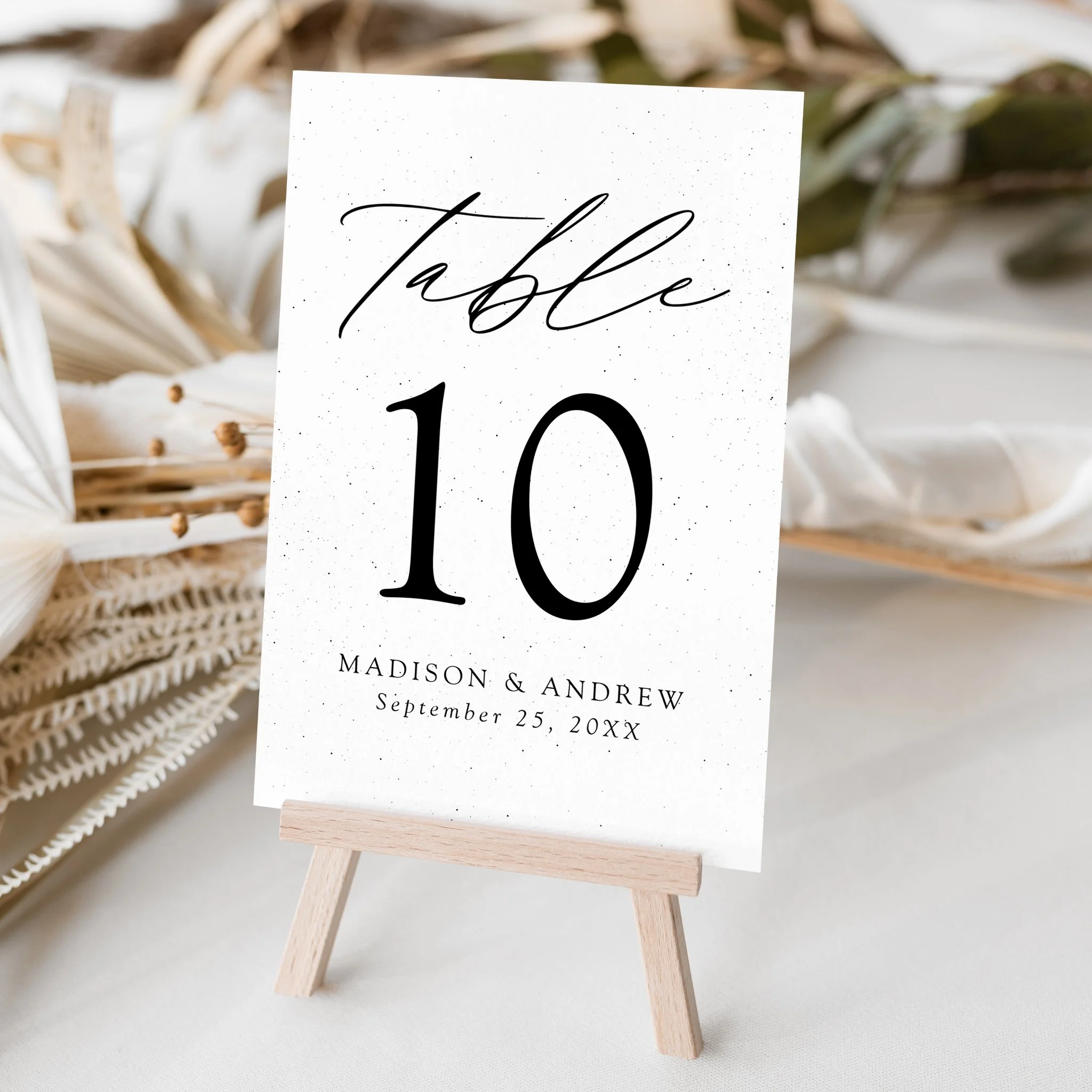 late-bloom-paperie_weddings_cover-photos_modern-elegance_table-card_speckled-white-and-black.jpg