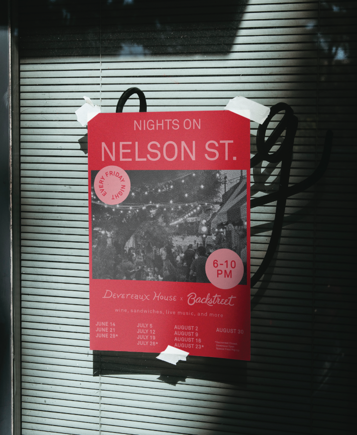 Poster advertising nighttime events on Nelson Street, featuring wine, sandwiches, live music, and more, held every Friday night from 6 to 10 PM at Devereaux House and Backstreet. The poster includes event dates from June to August and a black-and-white photo of an outdoor gathering with string lights.