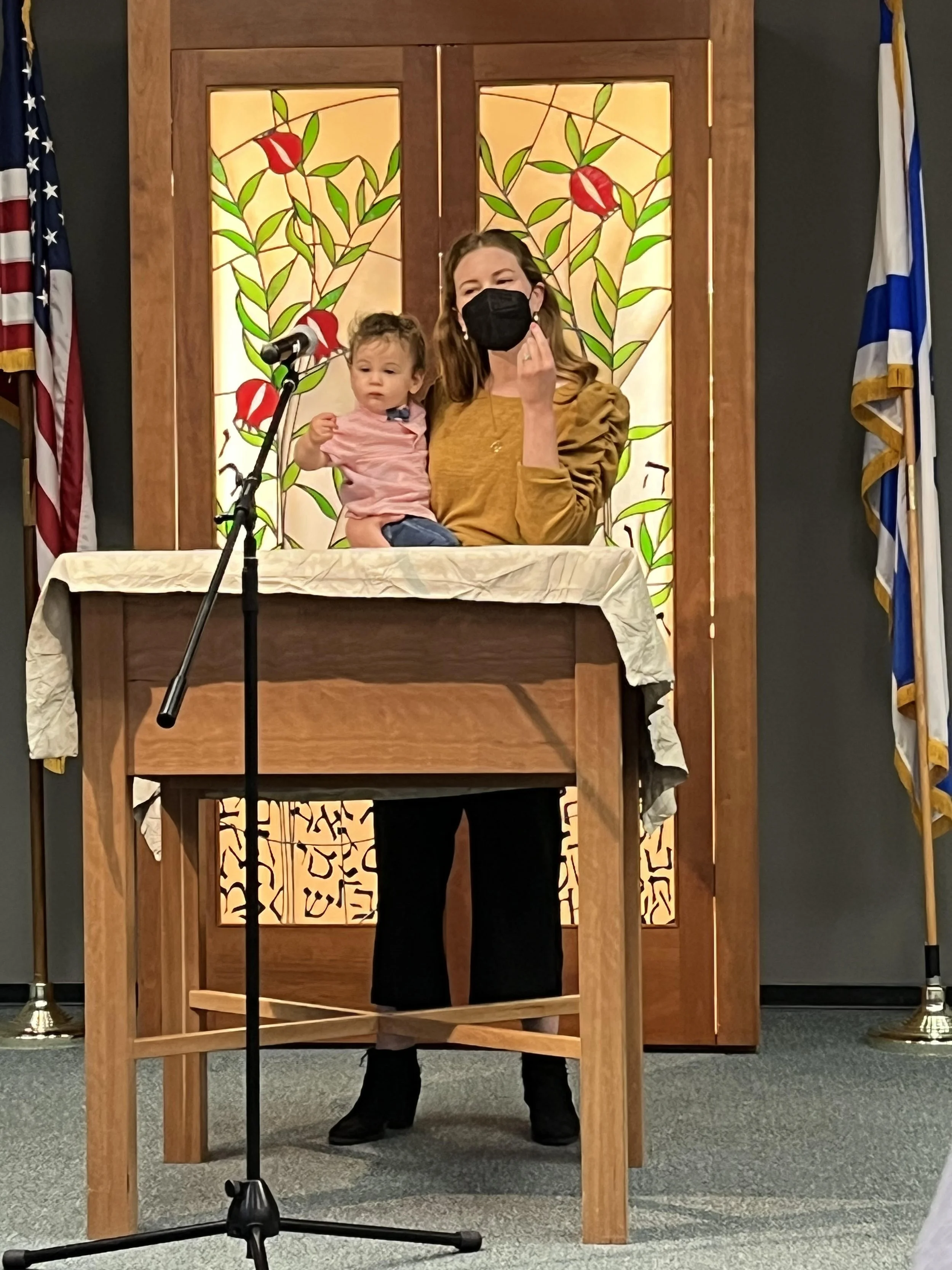 Rabbi Anna leading a baby naming ceremony with toddler.jpeg