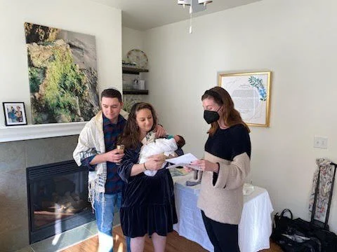 Rabbi Anna leading a baby naming ceremony.jpeg