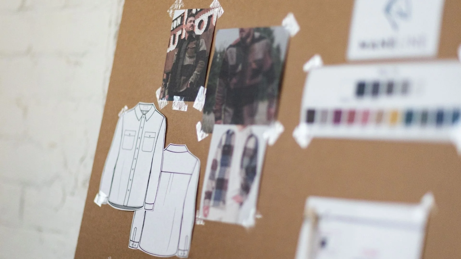 This is an image of a mood board and sketch of men's button-up shirt with a blurred color palette in the foreground.