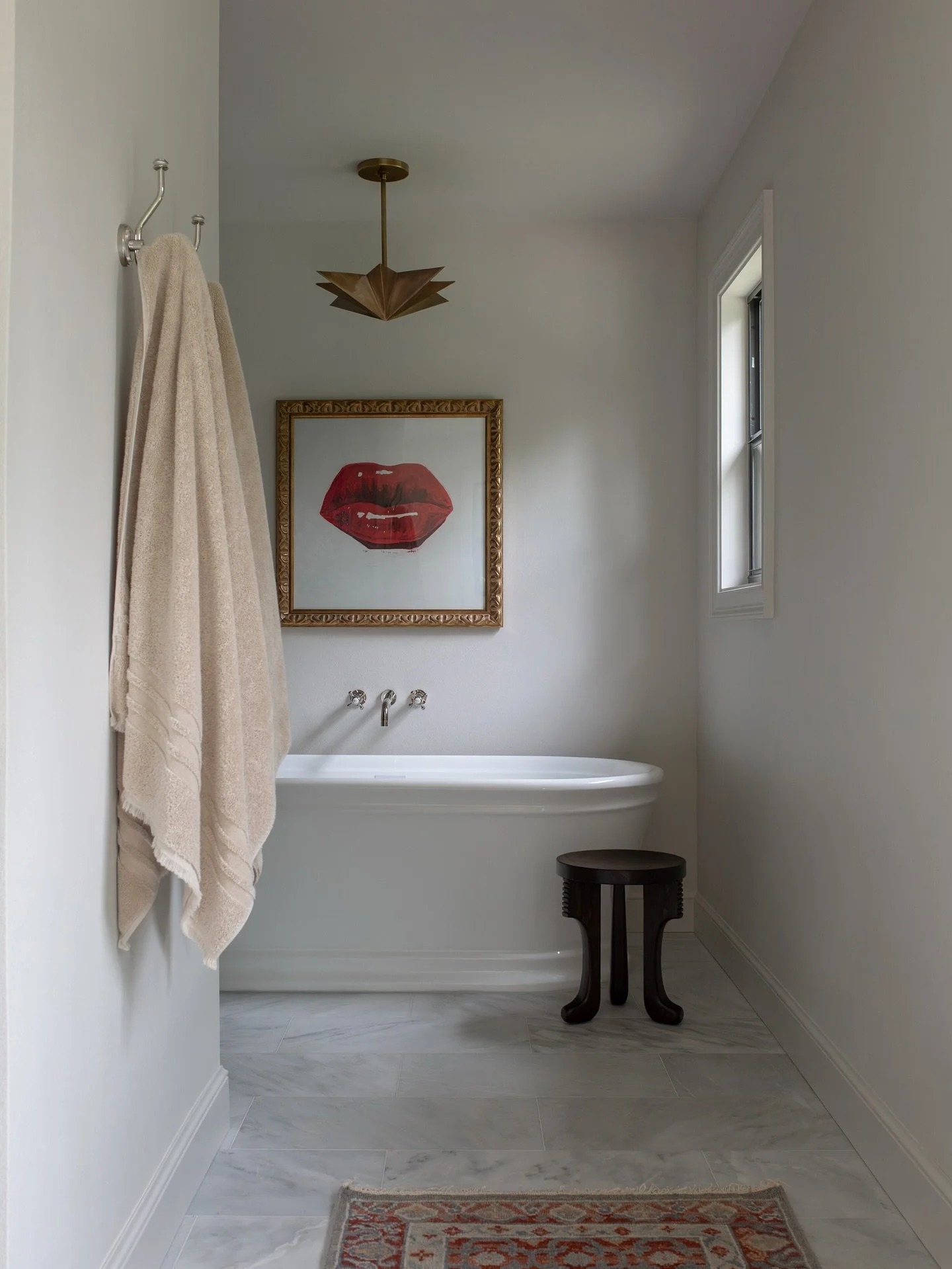 A little before &amp; after of the same view. 

By reconfiguring the floor plan and reclaiming underutilized square footage, we carved out a serene tub moment. Proof that smart spatial planning is the ultimate luxury.

Partnering with @kingstonbrass 