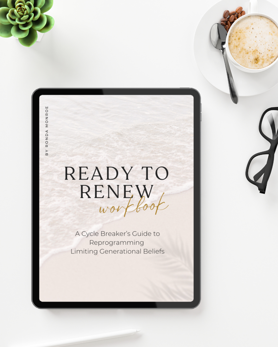 Digital tablet displaying a book titled 'Ready to Renew Workbook' with a beach background, alongside a cup of coffee with coffee beans, a succulent plant, a pair of glasses, and a stylus on a white desk.