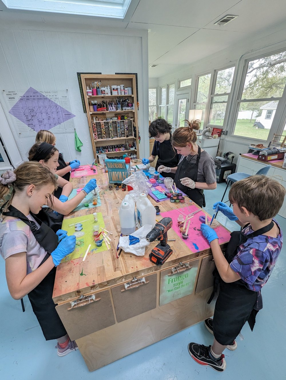 Students doing hands-on science around a table