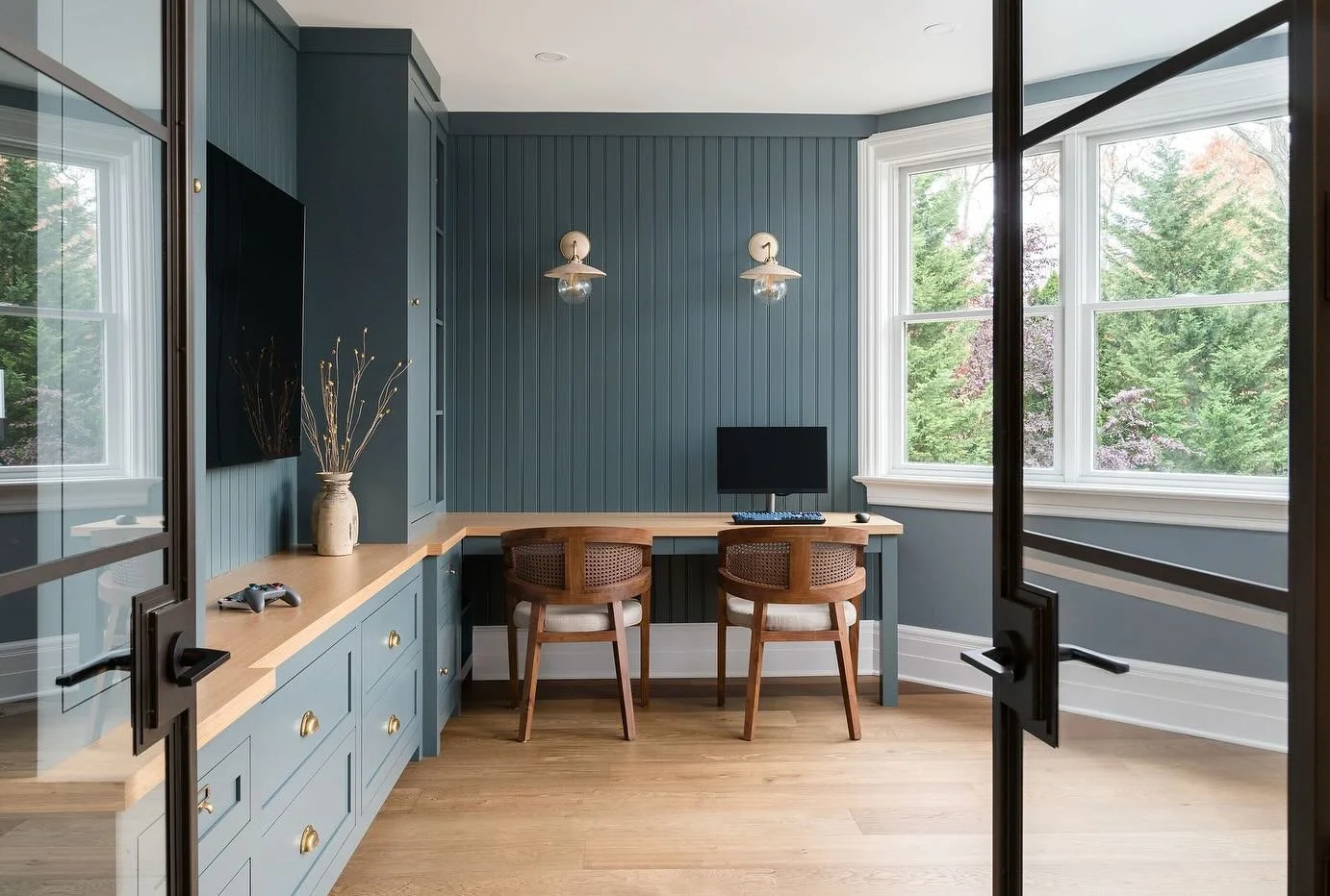Had a moment yesterday to revisit this gaming lounge we completed a few years ago.  Steel frame glass doors open to the family room and kitchen, which prompted sophisticated design decisions.  Not overly juvenile for this growing family. #kgid #kateg