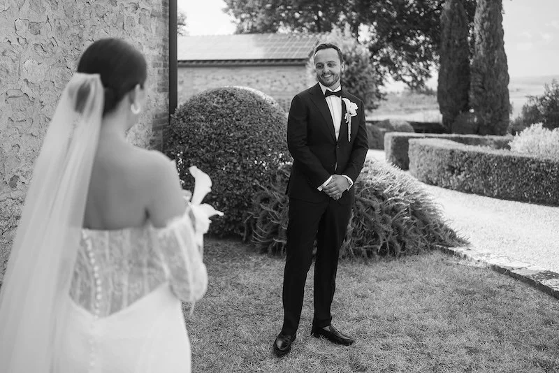 The groom sees the bride during the "first look" at Villa Boscarello; black-and-white photo