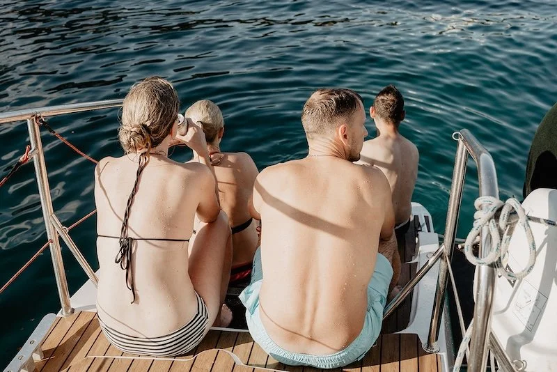 Spending time with friends on the boat the day before a destination wedding