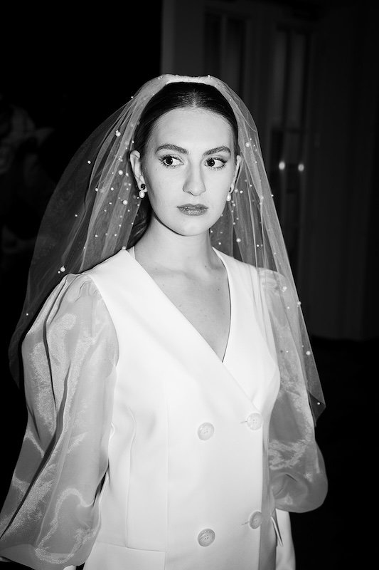 Black and white photo of a bride with veil