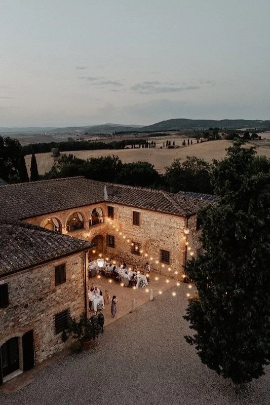 Aerial view of the illuminated courtyard of Villa Boscarello during the wedding dinner