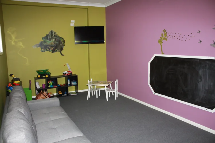 The kids room with toys and seating