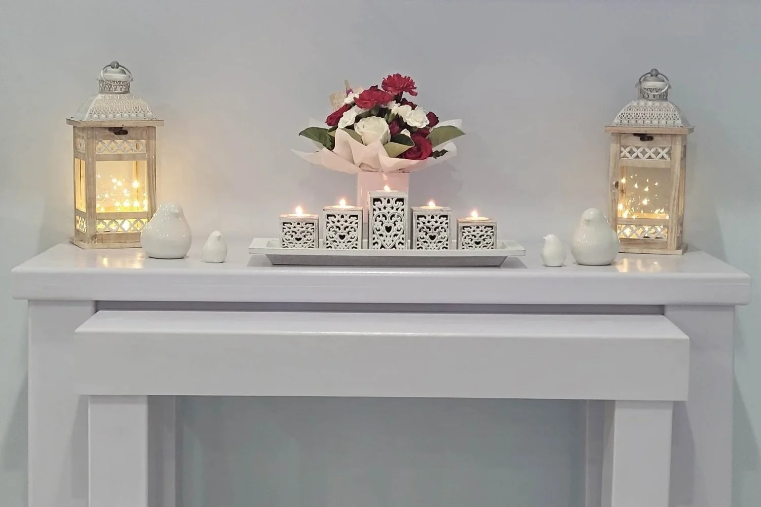 A peaceful display with candles and flowers