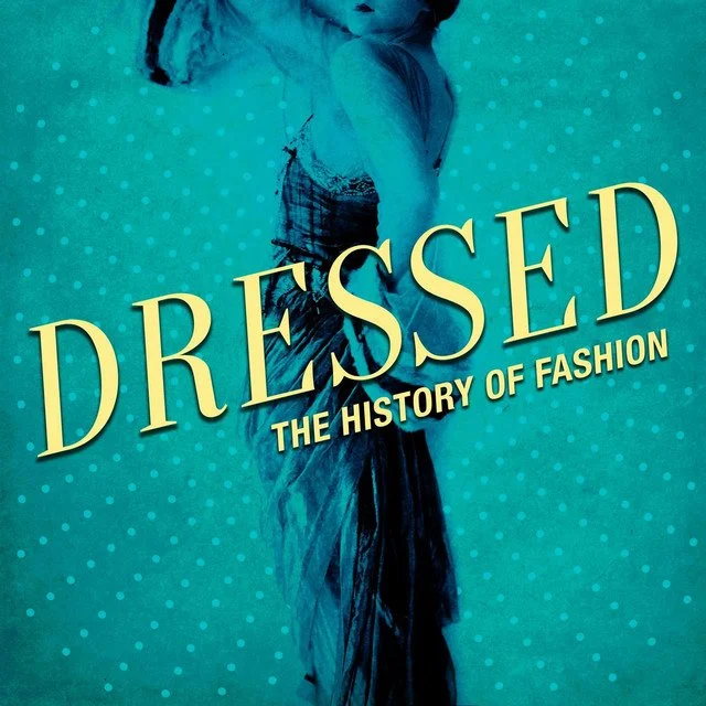 Book cover titled 'Dressed: The History of Fashion' featuring a woman in vintage clothing against a blue polka dot background.