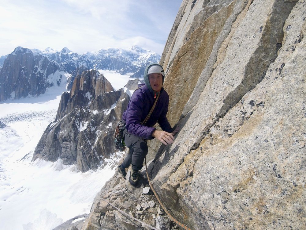 High up on the West Pilar of the Eye Tooth with Mt. Denali in the background