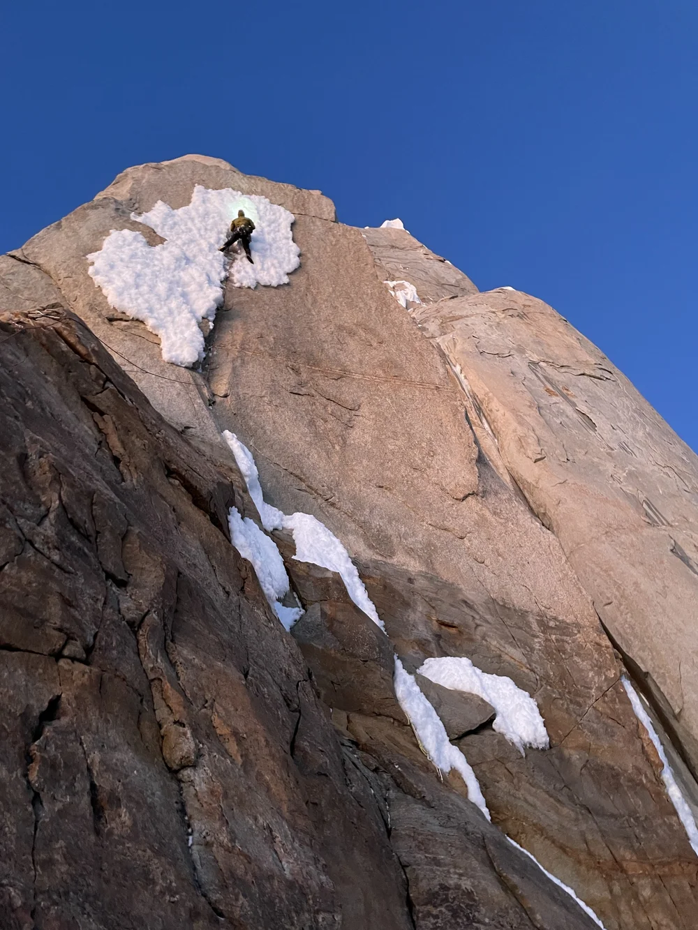 Progressing up through the rimed up crack (Photo: Colin Haley)