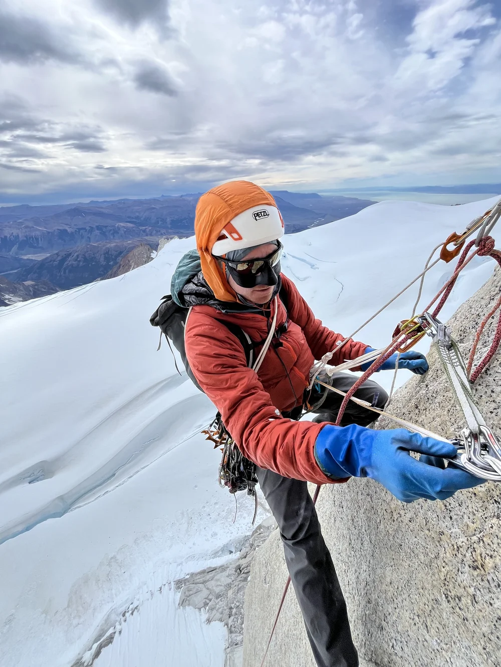 Batman wearing Robin's gloves