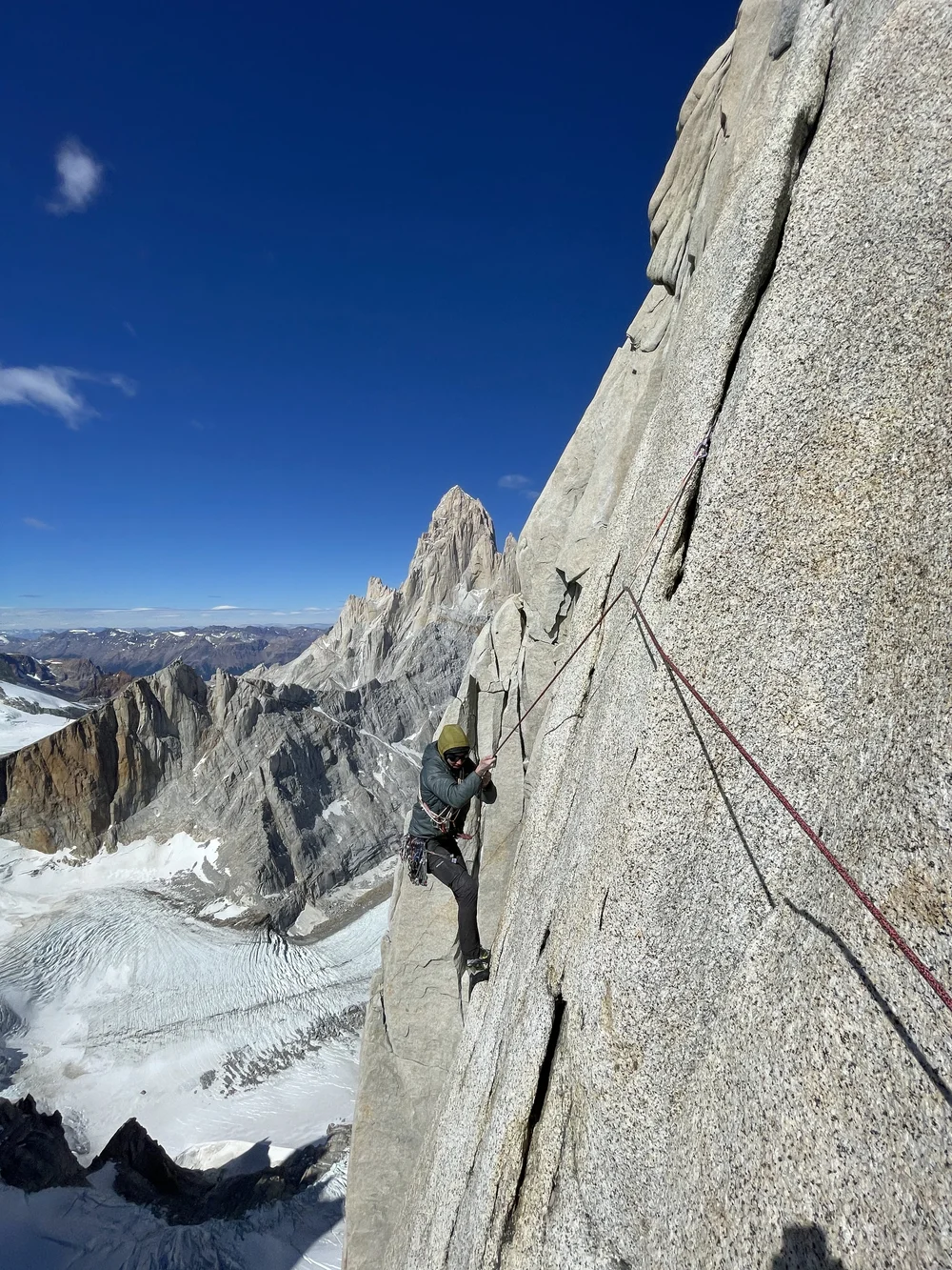 Lowering down to pendulum over to a new crack system (Photo: Colin Haley)