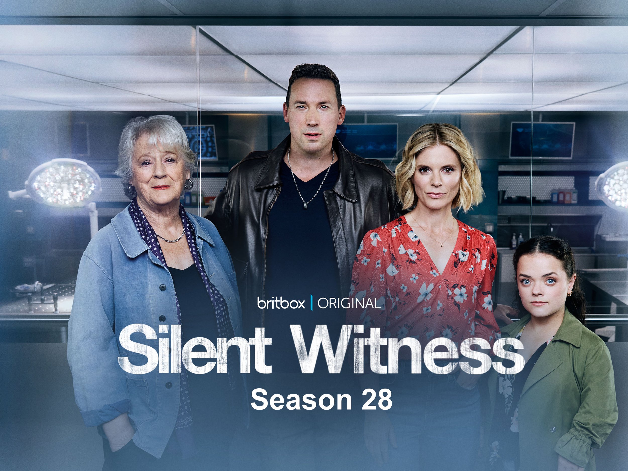 Group of five people standing behind a glass partition in a laboratory setting, promoting the show "Silent Witness" Season 28 on BritBox.